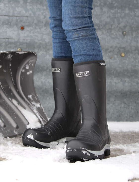 Quatro Boots shoveling snow